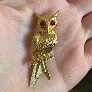 Vintage BSK gold-toned owl brooch with a textured metal finish
